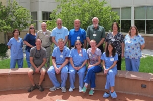 Seated (L to R): Robert Weisbrod, Matthew Graham, Pat Jenkins, Lori Kramer, Lisa Ashley. Standing (L to R): Dorothy Archuleta, Ashley Willhite, Ron Bobo, Mark Risinger, Facilities Manager Dan Christianson, Team Leader John Dickson, Michelle Leach and Teddie Sterle.