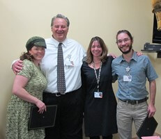 alida hospital CEO Bob Morasko congratulates TRAC STAR of the year runners-up Liz Krasnow (L) and Vinnie Okada (far right) and winner Monica Hutson
