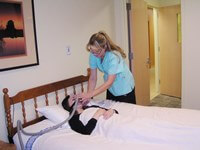 nurse assisting woman in sleep study